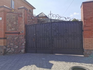 розкривні металеві ворота
